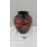 A Moorcroft 'Pomegranate' ovoid vase by William Moorcroft, circa 1920 (Restored).