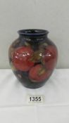 A Moorcroft 'Pomegranate' ovoid vase by William Moorcroft, circa 1920 (Restored).