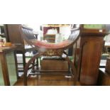 An Edwardian inlaid stool.