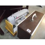 A cased Sewline 8 electric sewing machine.