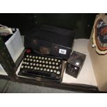 A cased Remington portable typewriter and a Brownie junior camera.