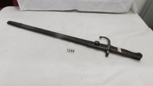 A bayonet with scabbard.