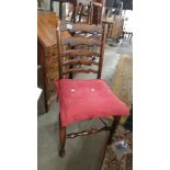 An oak ladder back chair.