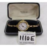 A vintage ladies 18ct gold wristwatch on a 9ct gold bracelet.