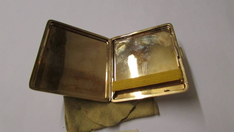 A 9ct gold cigarette case with Birmingham hall mark, 98.6 grams, outer 7.75 x 6.75 cm, inner 7 x 6. - Image 3 of 4