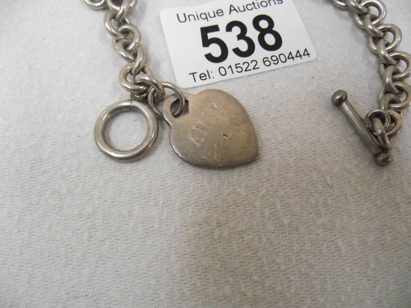 A silver heart (bracelet) on a metal bracelet. - Image 2 of 2