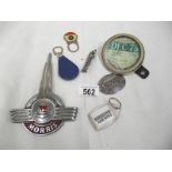 A mixed lot of old car related items including Morris badge, old tax disc holder etc.