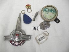 A mixed lot of old car related items including Morris badge, old tax disc holder etc.