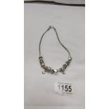 A Pandora style necklace.