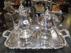 A silver plate tea/coffee set on tray.