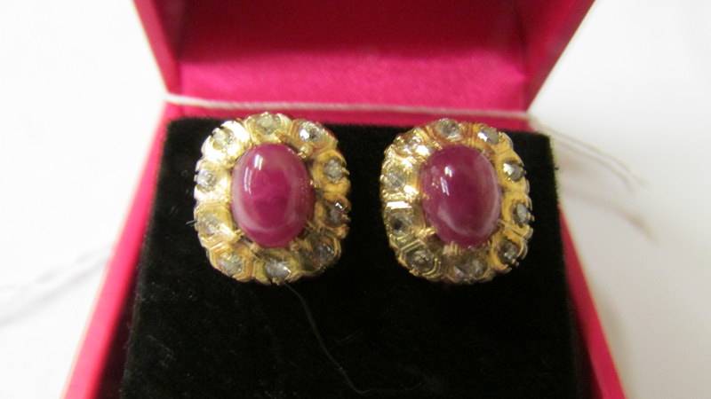 A pair of yellow gold ruby and diamond cluster earrings with screw backs. - Image 2 of 2