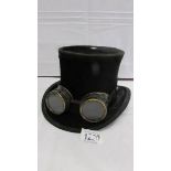 A top hat with 'steam punk' goggles by J Dawson, Edinburgh.