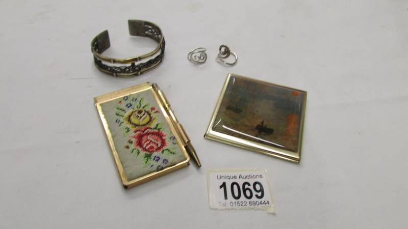 2 silver rings, 2 vintage notecases and a bangle.