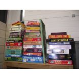 A large quantity of jigsaw puzzles (some still sealed) including old games and bagatelle.