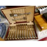 A cased set of silver handled fish knives and forks with servers.