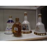 Three Royalty related Wade whisky bells with contents and a vintage bottle of Dimple whisky.