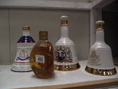 Three Royalty related Wade whisky bells with contents and a vintage bottle of Dimple whisky.