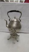 A silver plate spirit kettle on stand complete with burner.