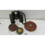 A pair of binoculars, a leather G.P.O tape measure and an Ottoway instrument in leather case.