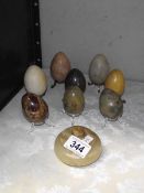 A quantity of marble eggs and a lidded dish.