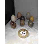 A quantity of marble eggs and a lidded dish.