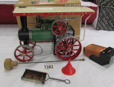 A boxed Mamod steam traction engine.