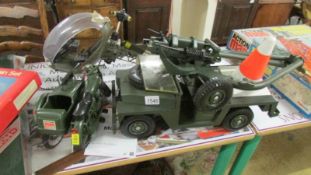 An unboxed action man helicopter, motorcycle, jeep etc.