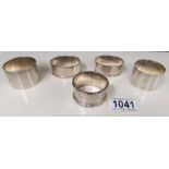 5 hall marked silver napkin rings.