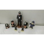A collection of Doulton police related figures including jugs, Sgt Peeler, Bunnikins,