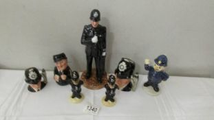 A collection of Doulton police related figures including jugs, Sgt Peeler, Bunnikins,