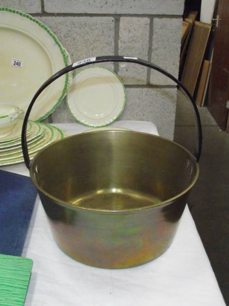 A Victorian brass jam pan.