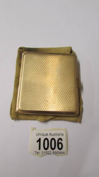 A 9ct gold cigarette case with Birmingham hall mark, 98.6 grams, outer 7.75 x 6.75 cm, inner 7 x 6.