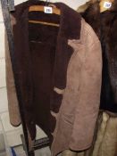 A sheepskin coat, size 38.