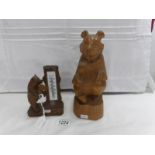 A carved bear thermometer and another carved bear,