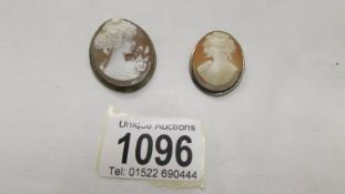 Two cameo brooches/pendants of female profiles.