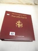 An album of Pope John Paul II first day covers.