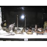 A shelf of assorted metalware including Austrian spelter deer, Indian brassware,