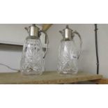 A pair of good quality cut glass claret jugs with plated fittings.