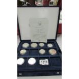 9 silver dollars and half dollars from official coins of the USA in box including Walking liberty