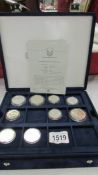 9 silver dollars and half dollars from official coins of the USA in box including Walking liberty