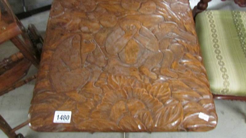 A carved occasional table featuring monkeys. - Image 2 of 3