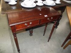 A dark wood stained slim hall table with 2 drawers.