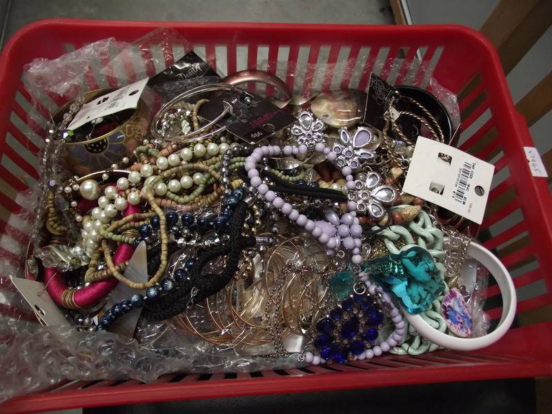 A basket of vintage and retro costume jewellery.