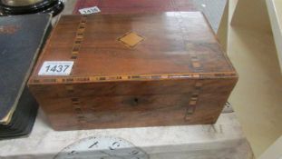 A mahogany inlaid box.
