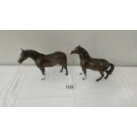 ABeswick pony (head up) circa 1950-1975 and another Beswick pony.