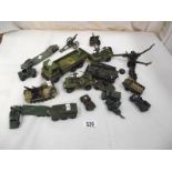 A collection of military die cast vehicles, cannons etc.