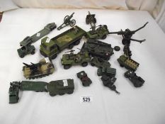 A collection of military die cast vehicles, cannons etc.