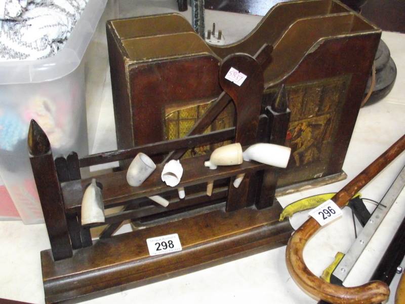 A vintage pipe rack with pipe and a magazine rack.
