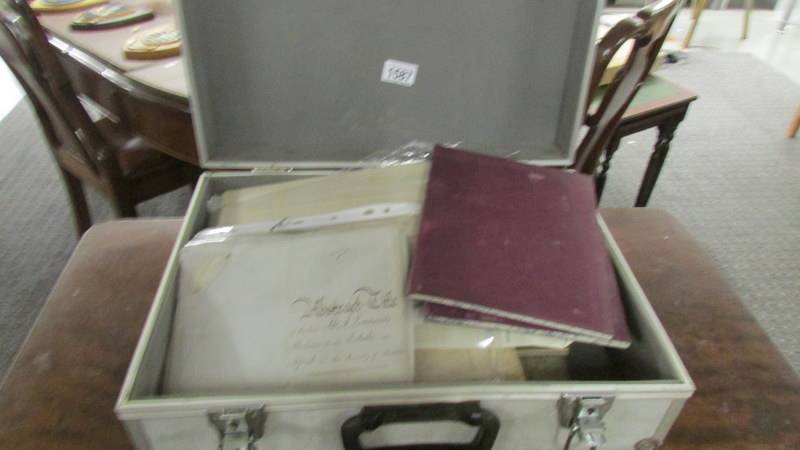 A metal case containing 19th century ephemera, documents etc.