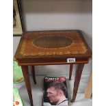 An inlaid musical box side table